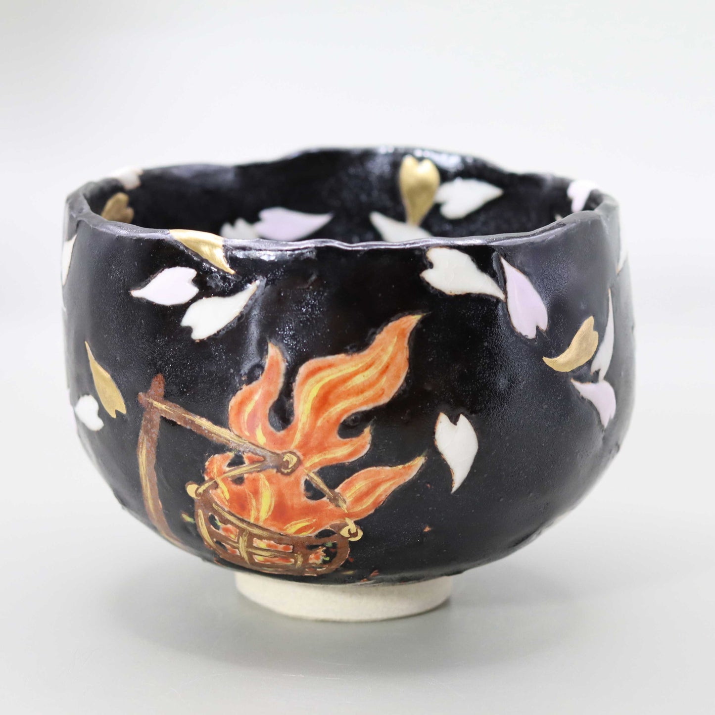 Raku tea bowl with a picture of flames by Kosai Miyagawa