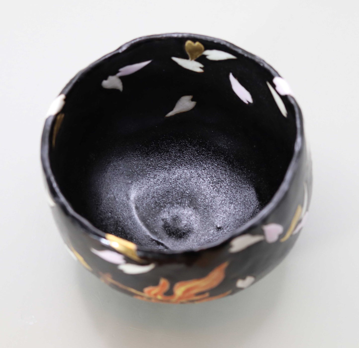 Raku tea bowl with a picture of flames by Kosai Miyagawa