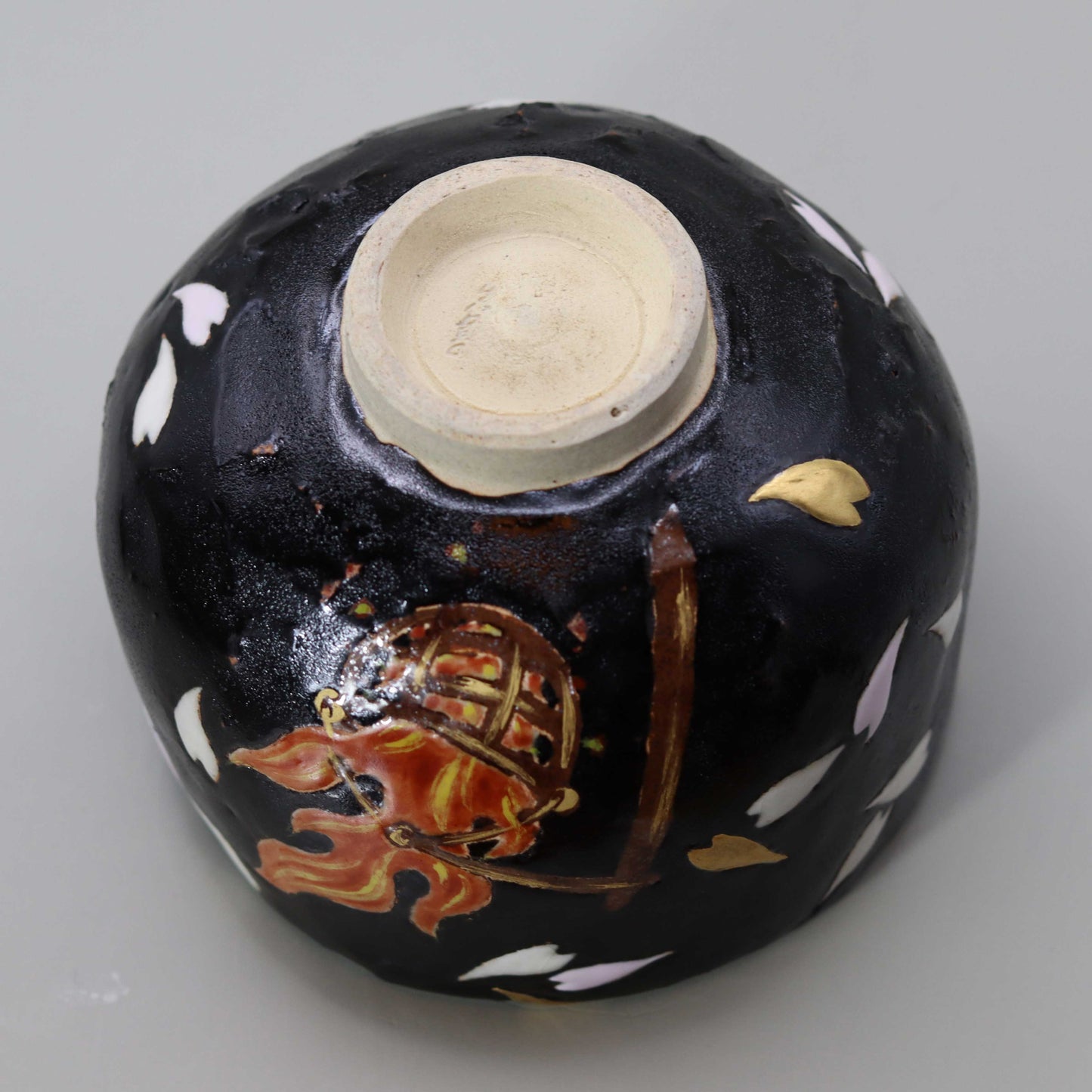 Raku tea bowl with a picture of flames by Kosai Miyagawa