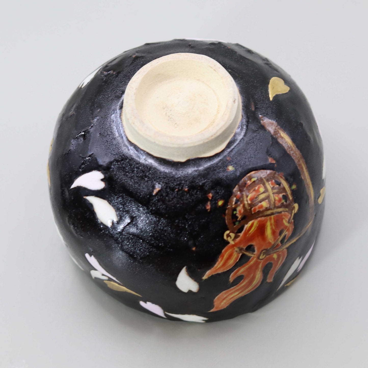 Raku tea bowl with a picture of flames by Kosai Miyagawa