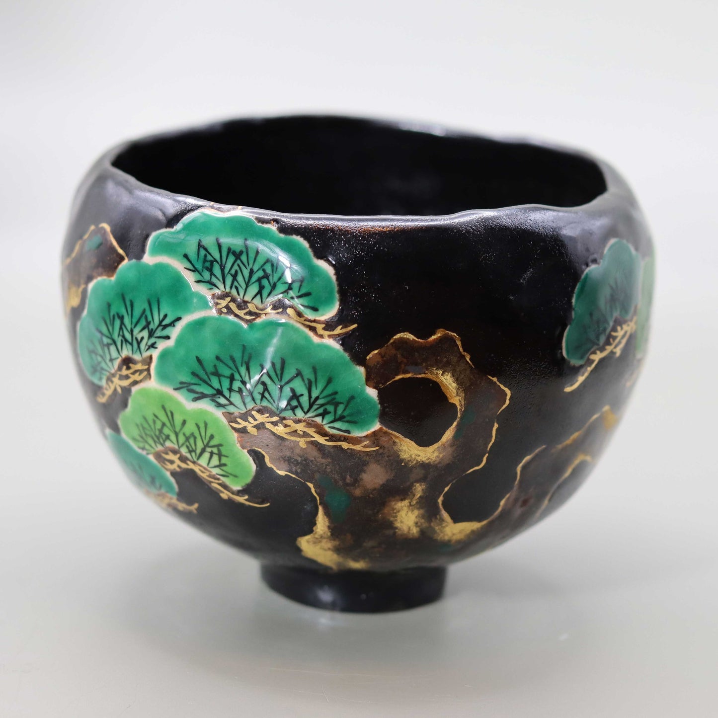 Raku tea bowl with pine by Kosai Miyagawa