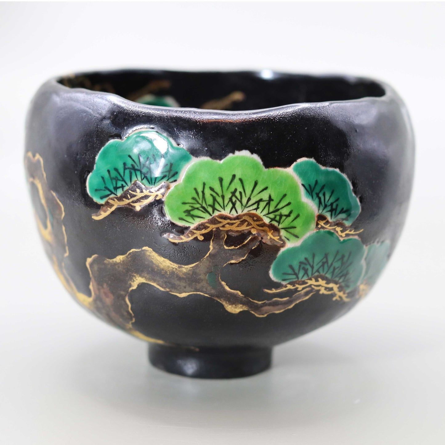 Raku tea bowl with pine by Kosai Miyagawa