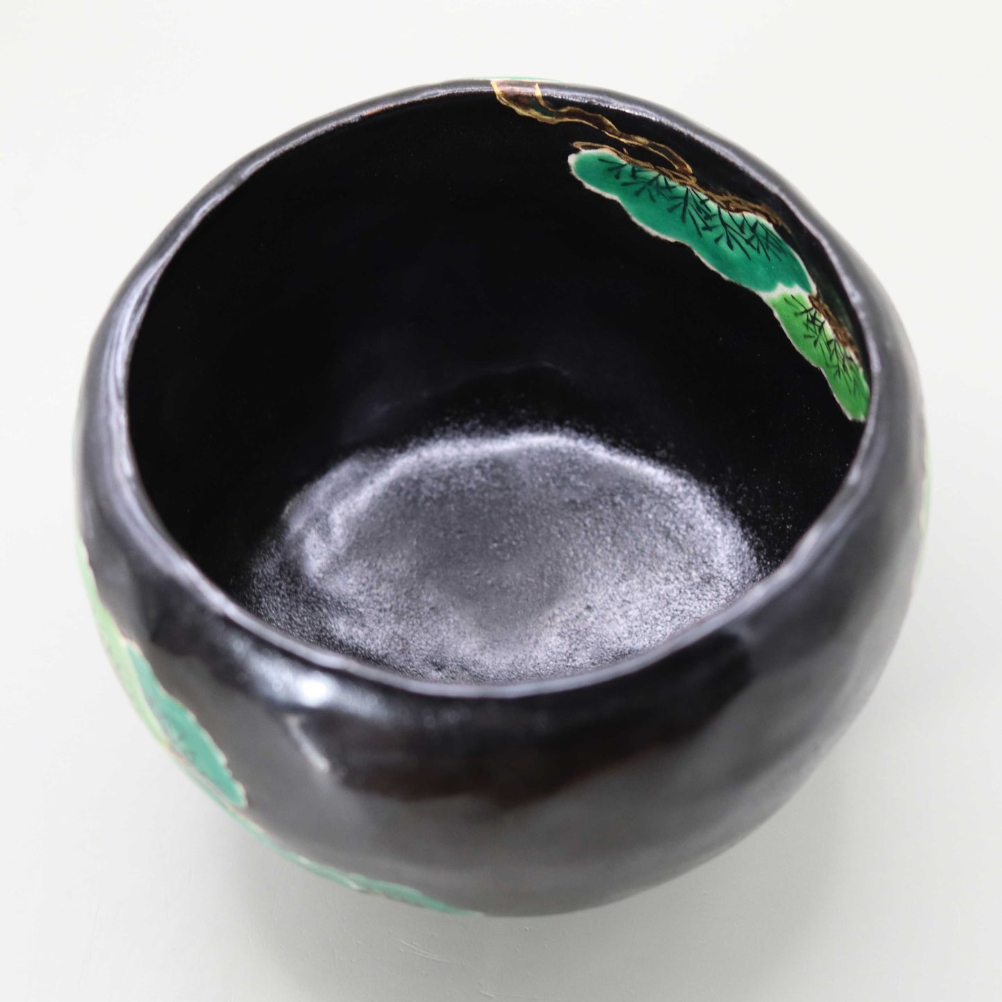 Raku tea bowl with pine by Kosai Miyagawa