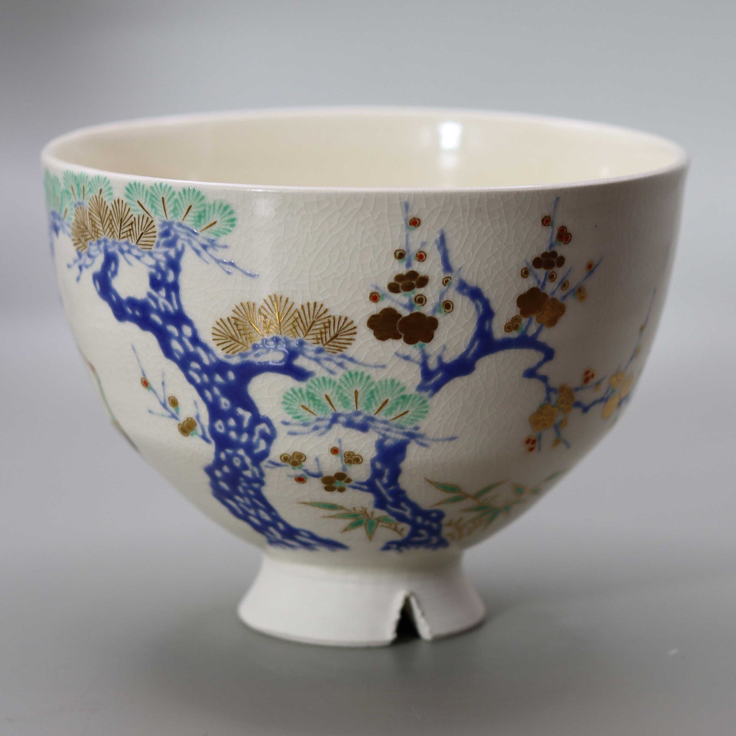 Tea bowl with a design of pine, bamboo, plum and crane, copied from Ninsei by Miyagawa Kosai