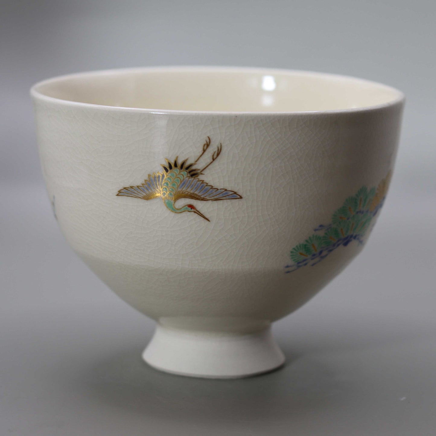 Tea bowl with a design of pine, bamboo, plum and crane, copied from Ninsei by Miyagawa Kosai