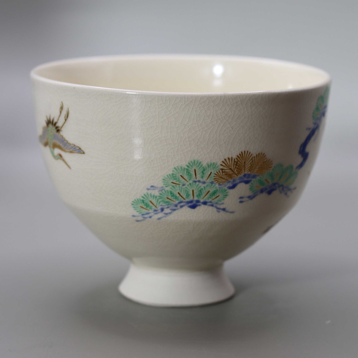 Tea bowl with a design of pine, bamboo, plum and crane, copied from Ninsei by Miyagawa Kosai