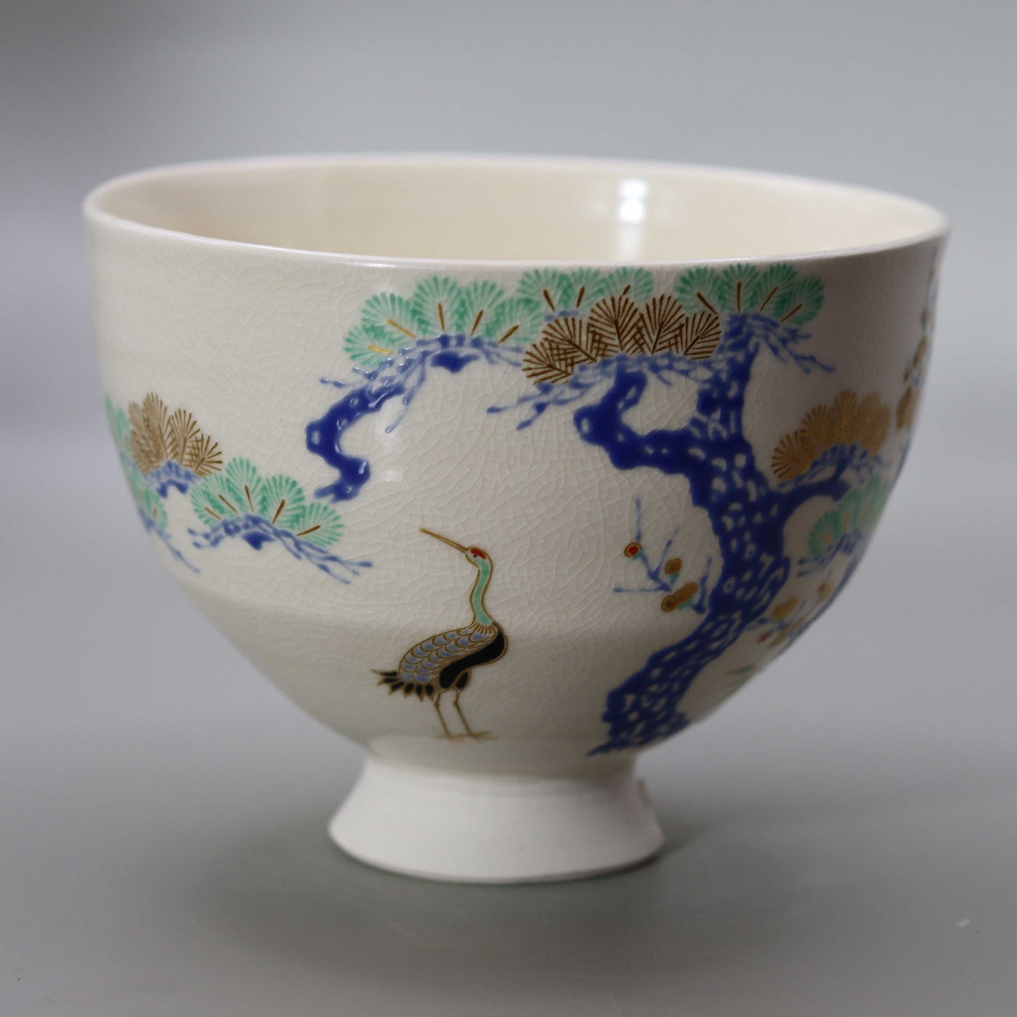 Tea bowl with a design of pine, bamboo, plum and crane, copied from Ninsei by Miyagawa Kosai