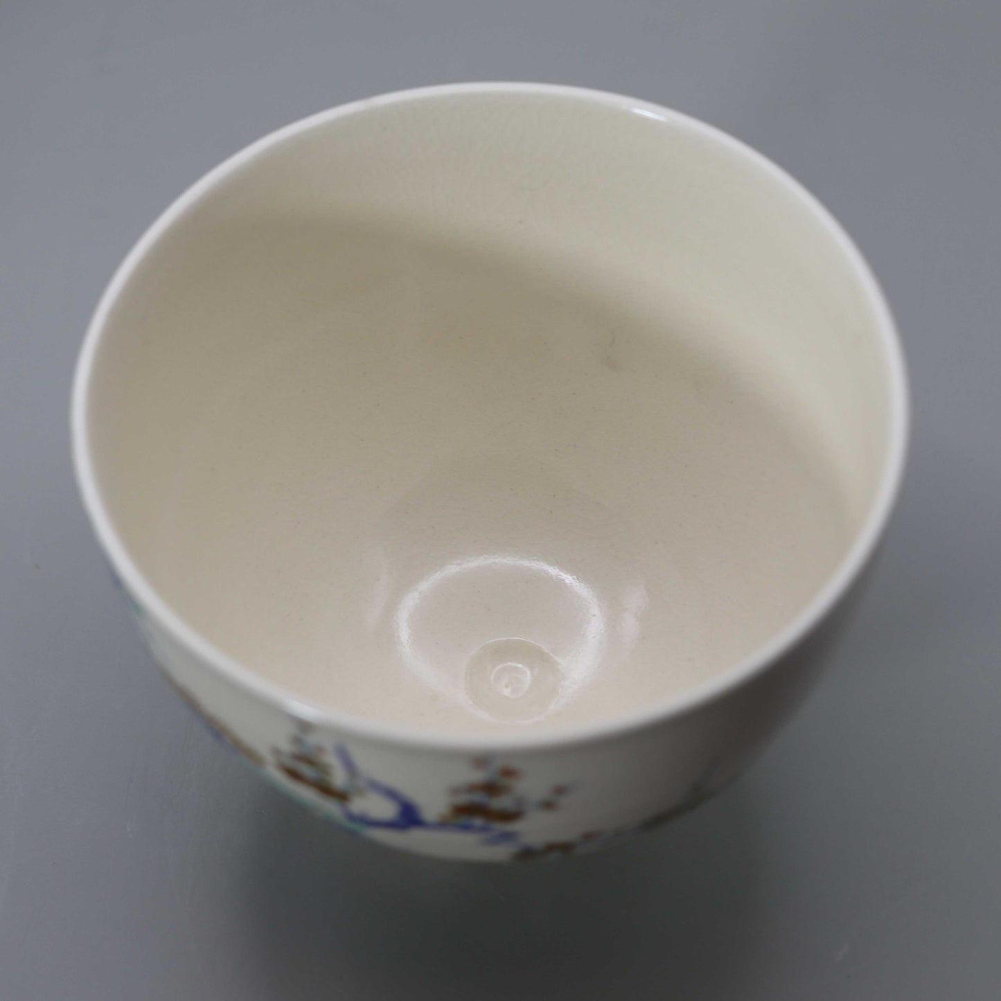 Tea bowl with a design of pine, bamboo, plum and crane, copied from Ninsei by Miyagawa Kosai