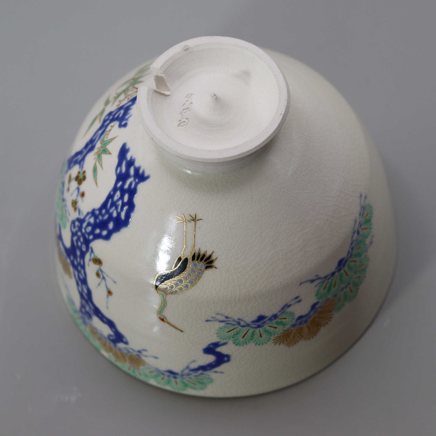 Tea bowl with a design of pine, bamboo, plum and crane, copied from Ninsei by Miyagawa Kosai