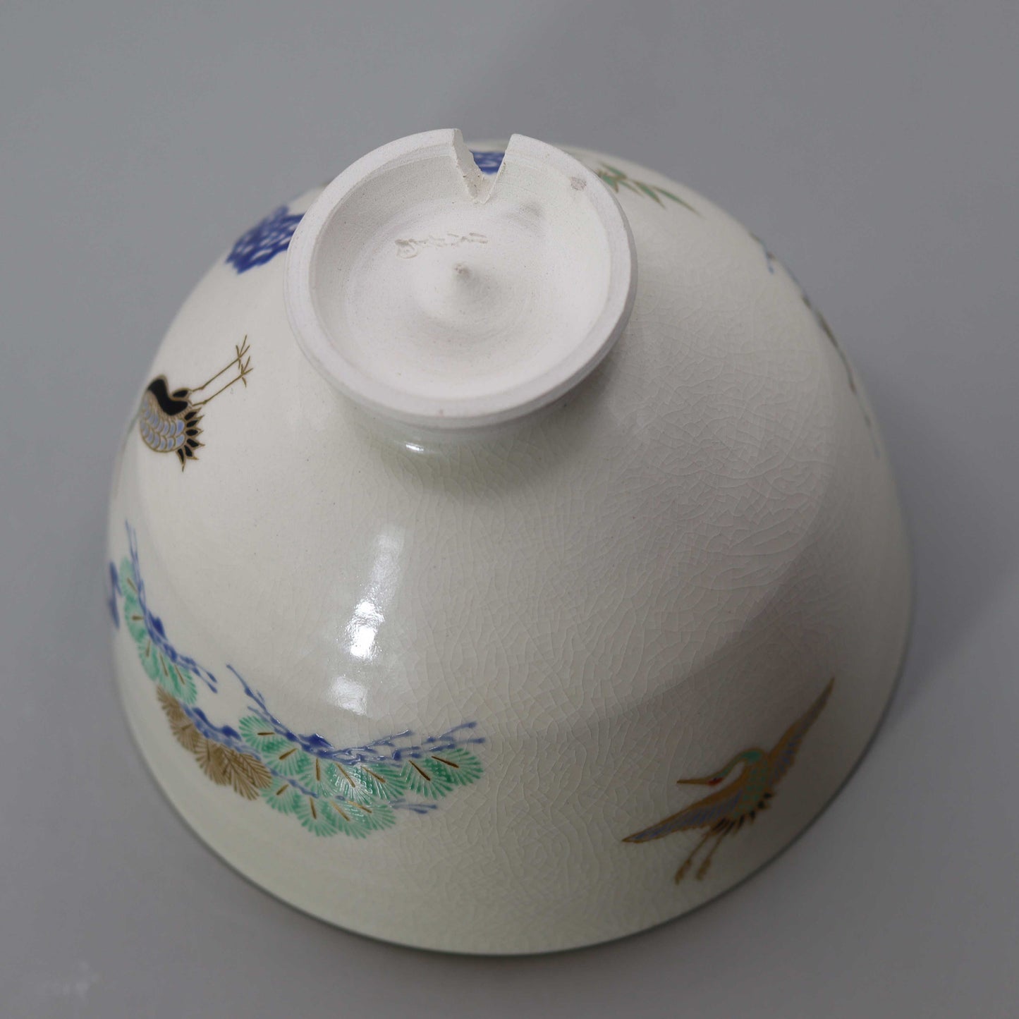 Tea bowl with a design of pine, bamboo, plum and crane, copied from Ninsei by Miyagawa Kosai