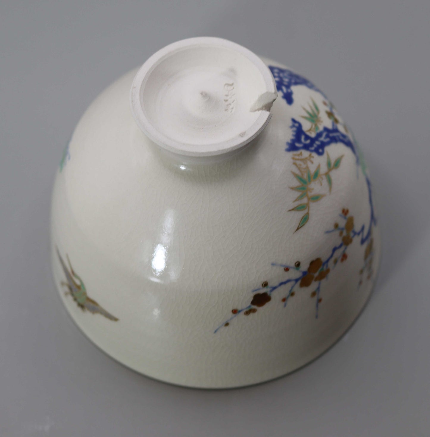Tea bowl with a design of pine, bamboo, plum and crane, copied from Ninsei by Miyagawa Kosai