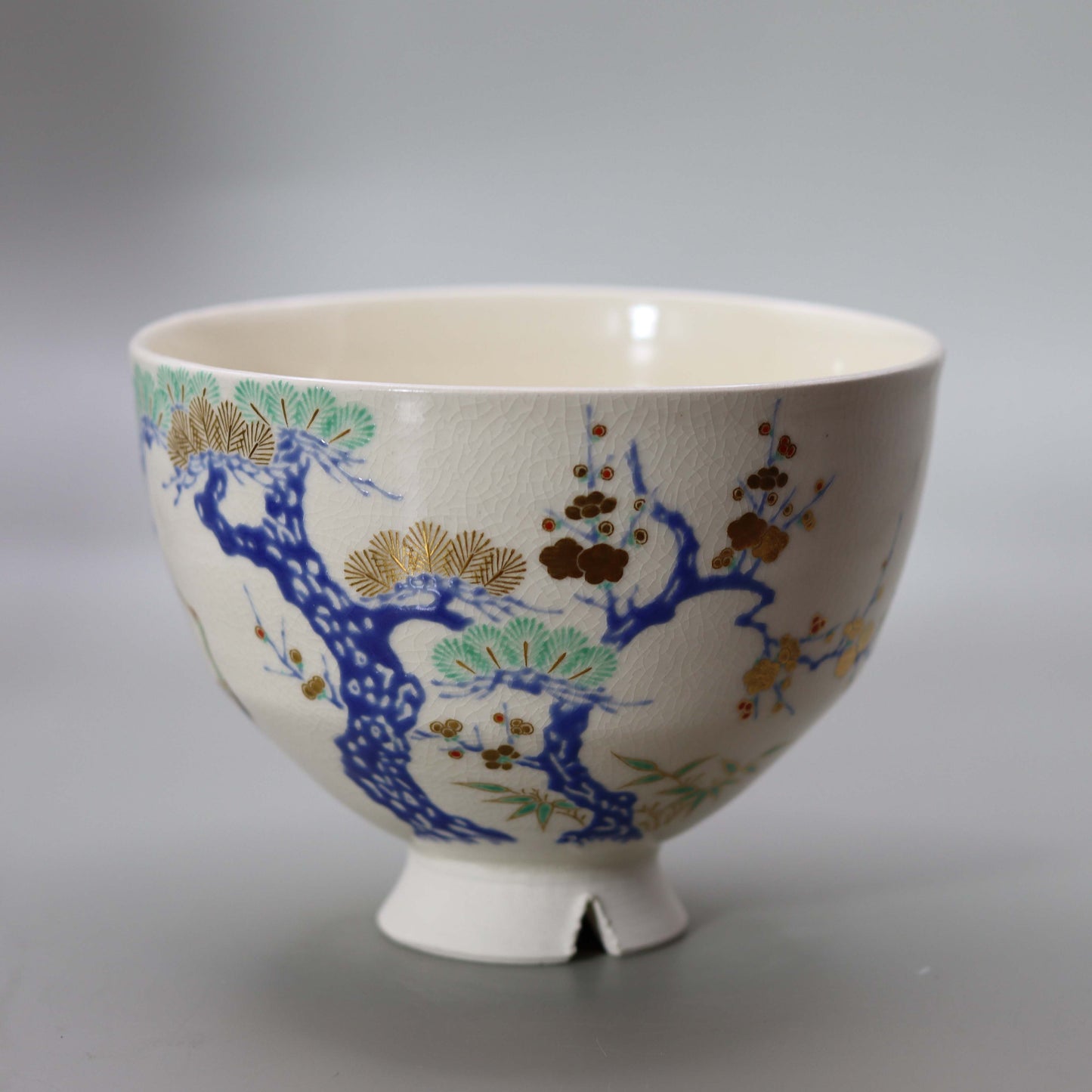 Tea bowl with a design of pine, bamboo, plum and crane, copied from Ninsei by Miyagawa Kosai