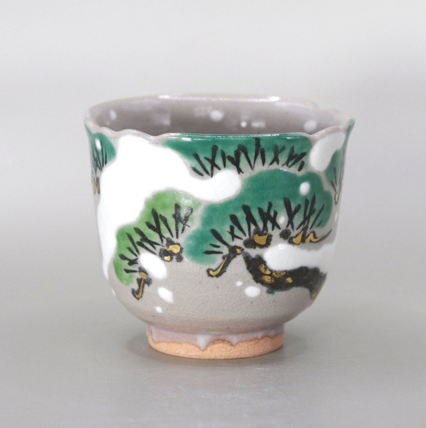 Kenzan's Snow and Pine Tree Sake Cup by Miyagawa Kosai