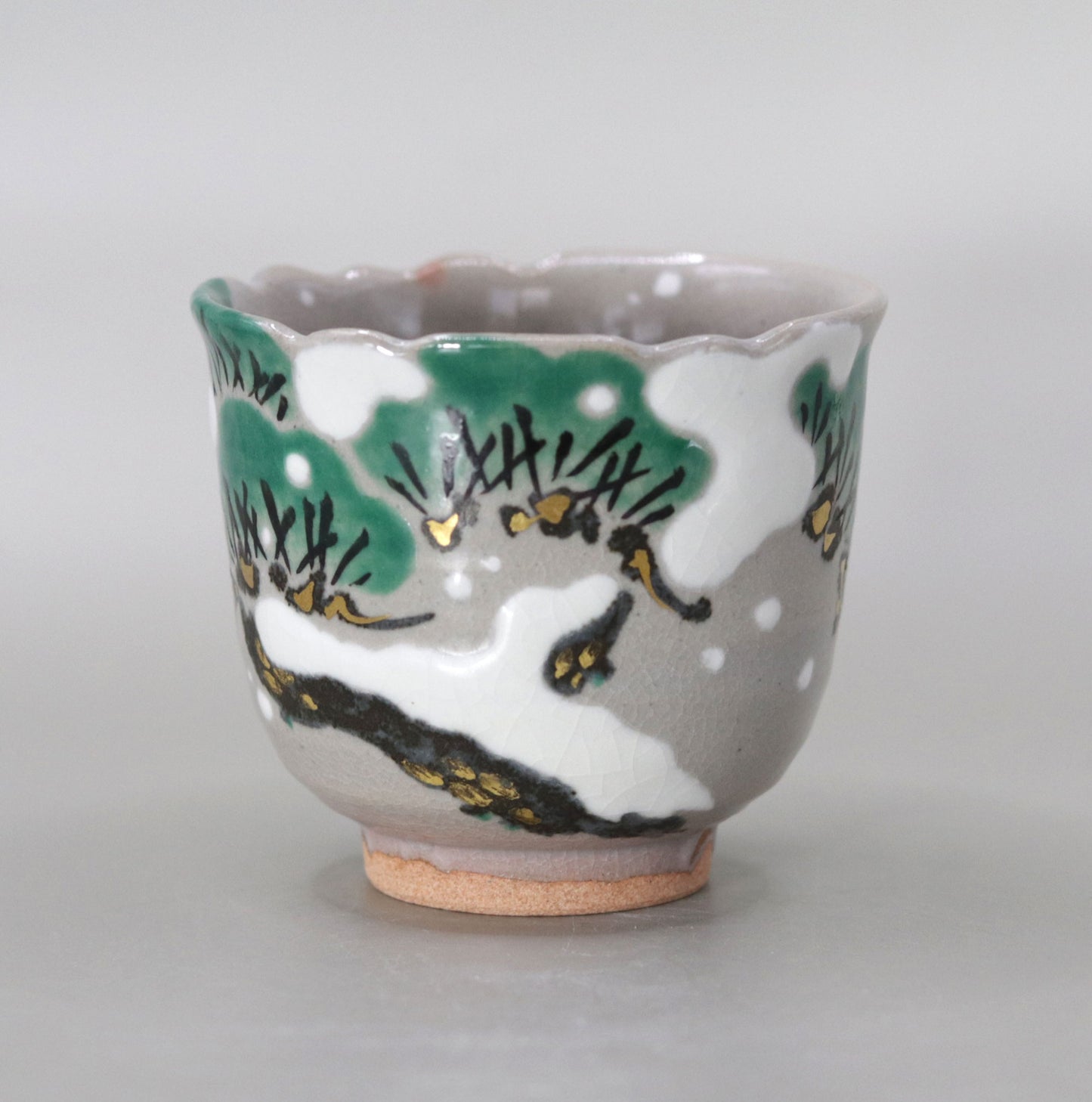 Kenzan's Snow and Pine Tree Sake Cup by Miyagawa Kosai