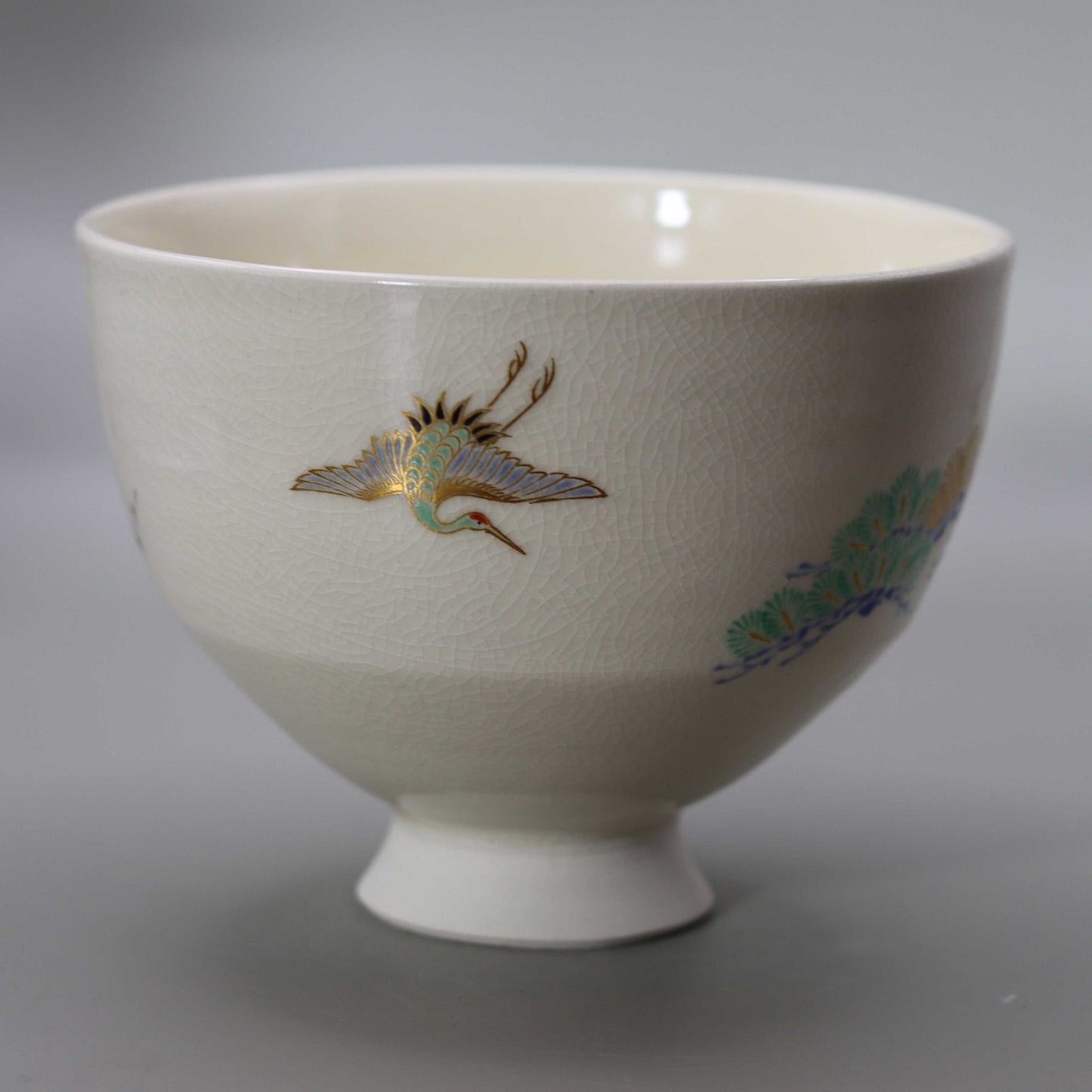 16 Tea bowl with a design of pine, bamboo, plum and crane, copied from Ninsei by Miyagawa Kosai