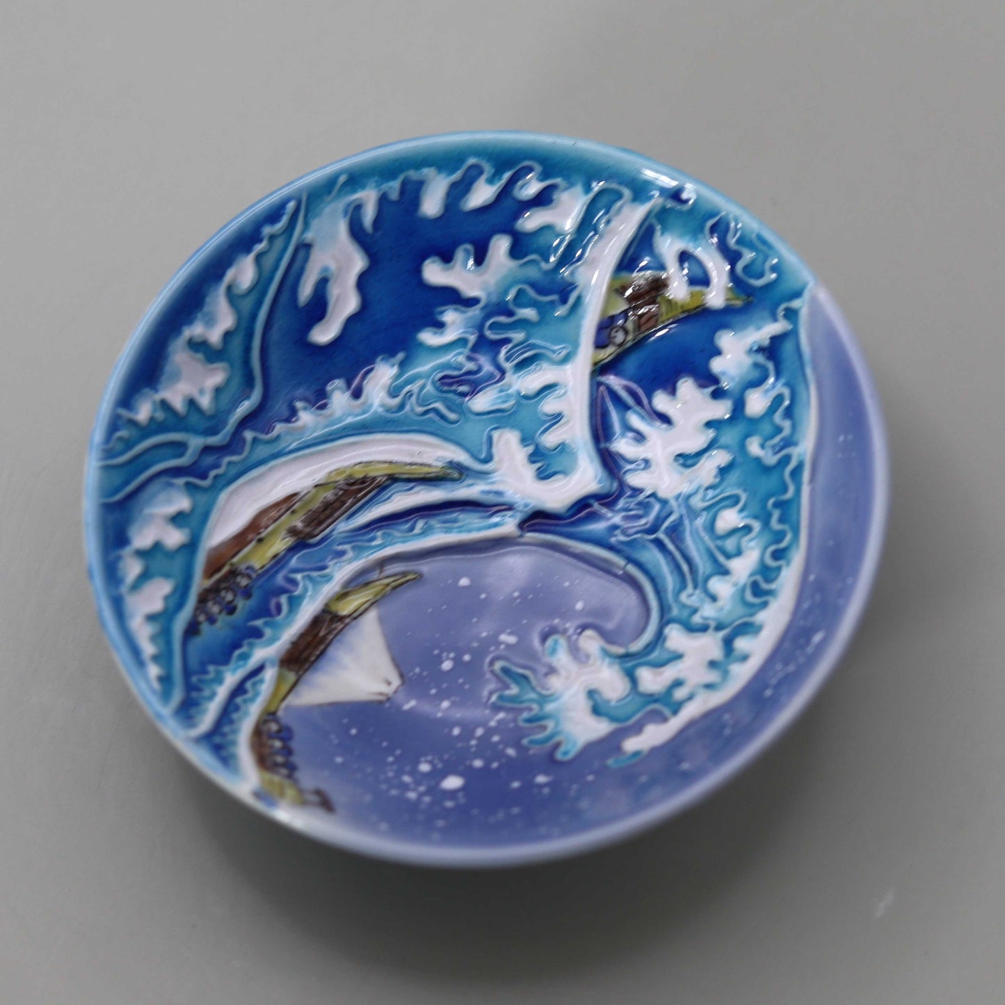 Blue and white Kochi Wave Back Flat Sake Cup by Miyagawa Kosai