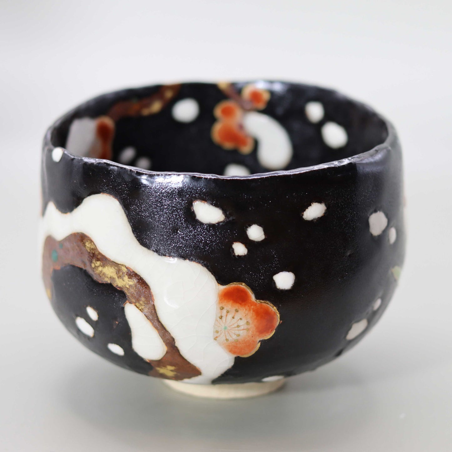 10 Black glaze hand-formed snow-covered plum tea bowl by Miyagawa Kosai