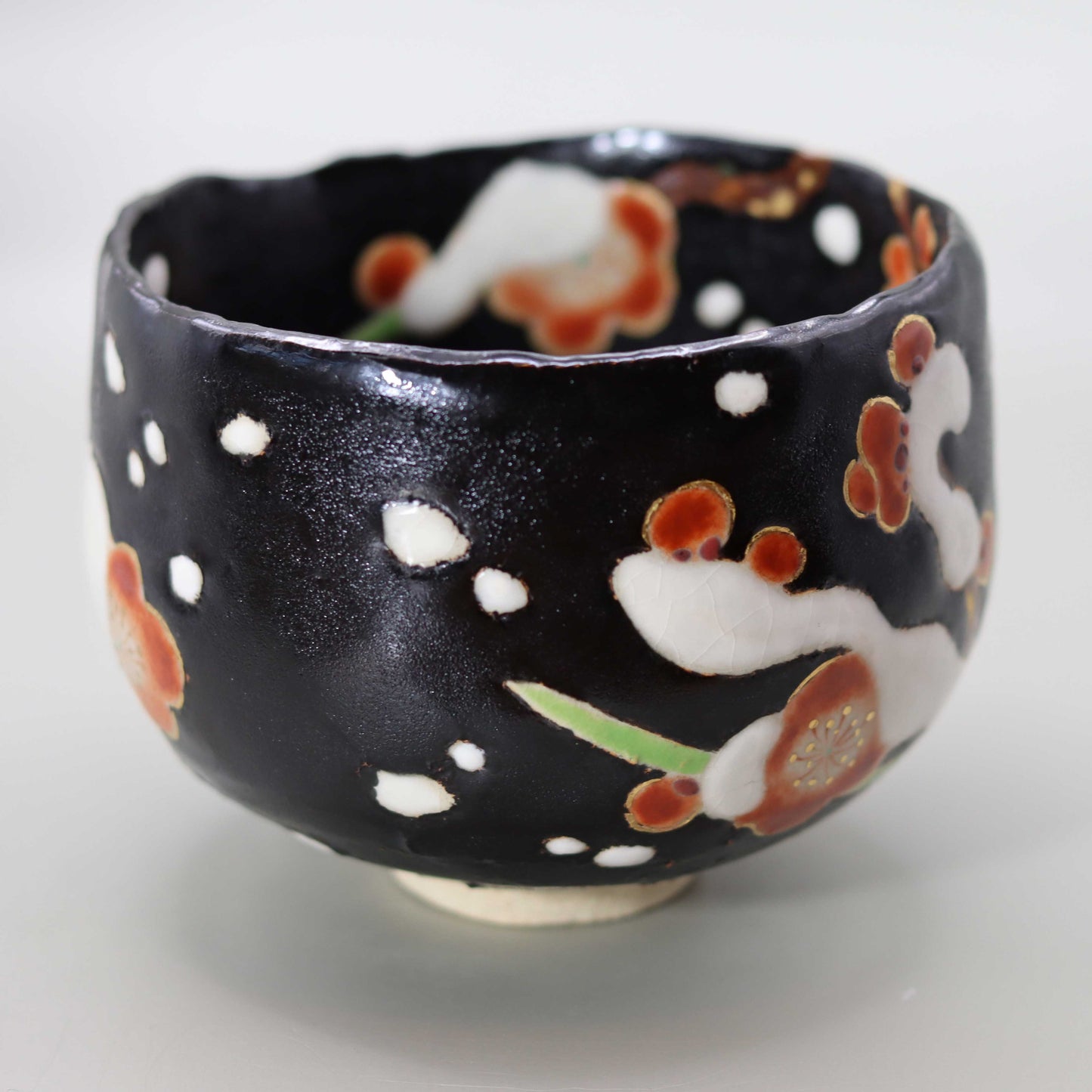 10 Black glaze hand-formed snow-covered plum tea bowl by Miyagawa Kosai