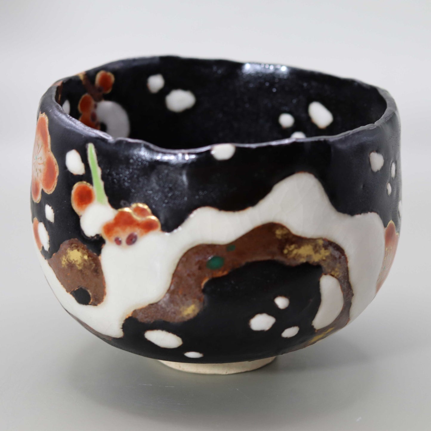 10 Black glaze hand-formed snow-covered plum tea bowl by Miyagawa Kosai