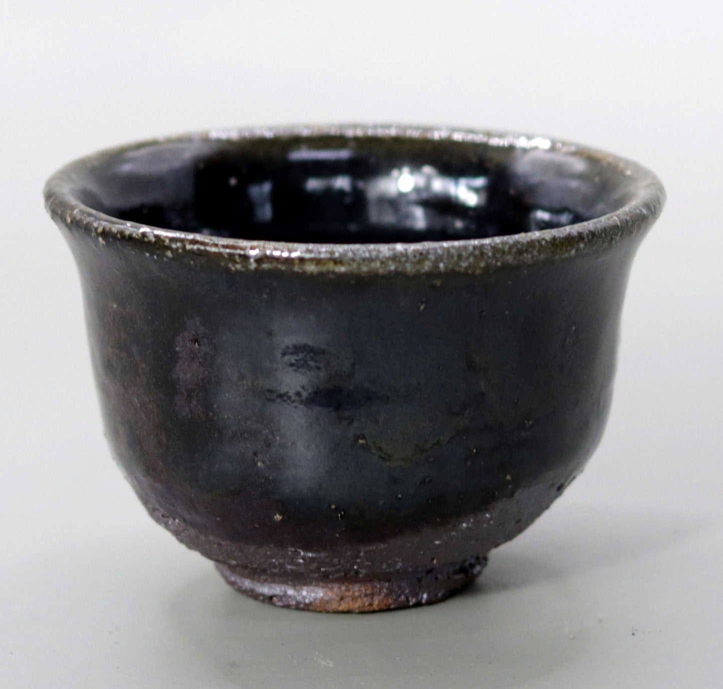 Iron glazed sake cup made from the foundation of the East Pagoda of Yakushiji Temple by Rakusai Bisai