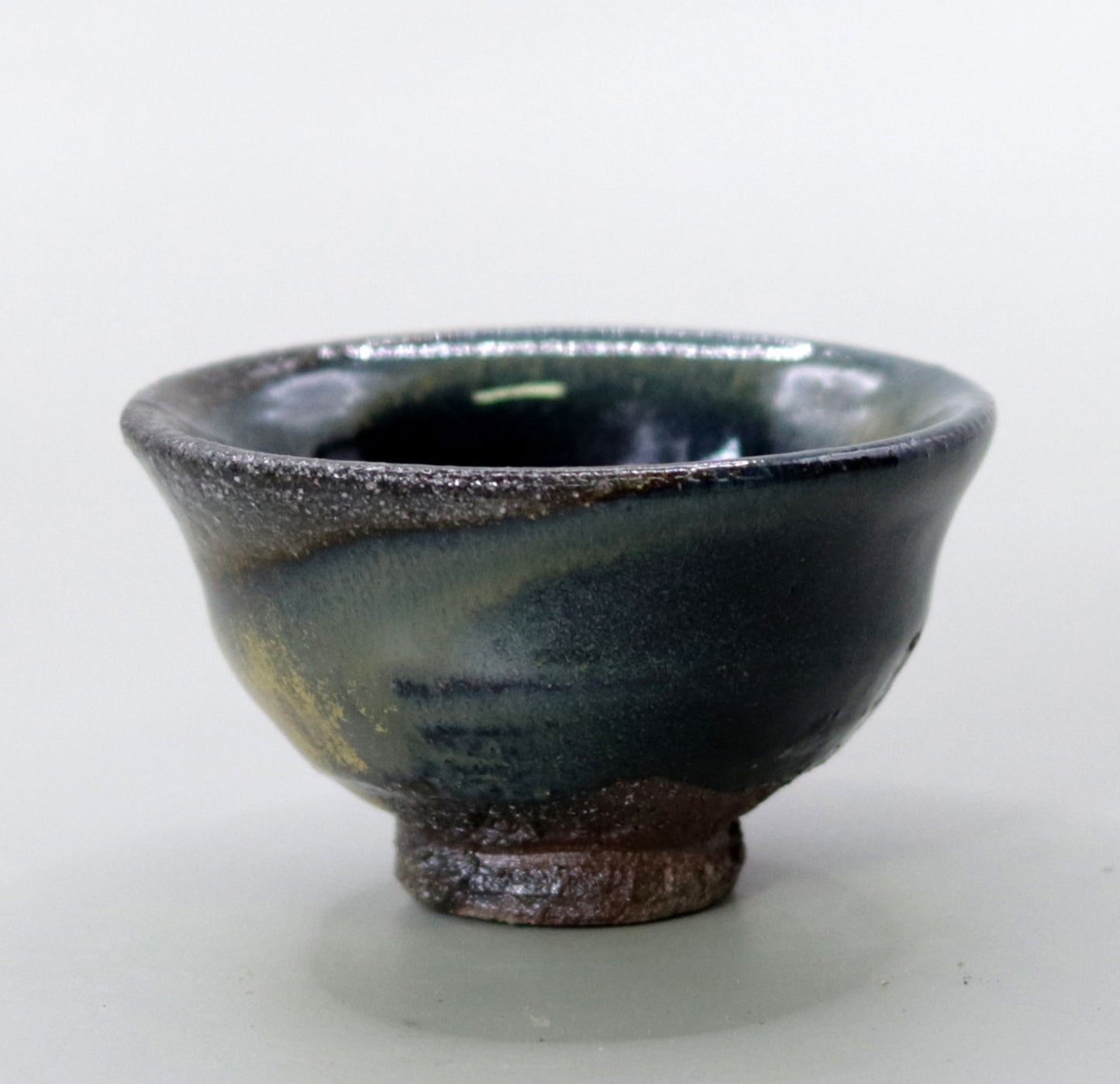 Iron glazed sake cup made from the foundation of the East Pagoda of Yakushiji Temple by Rakusai Bisai