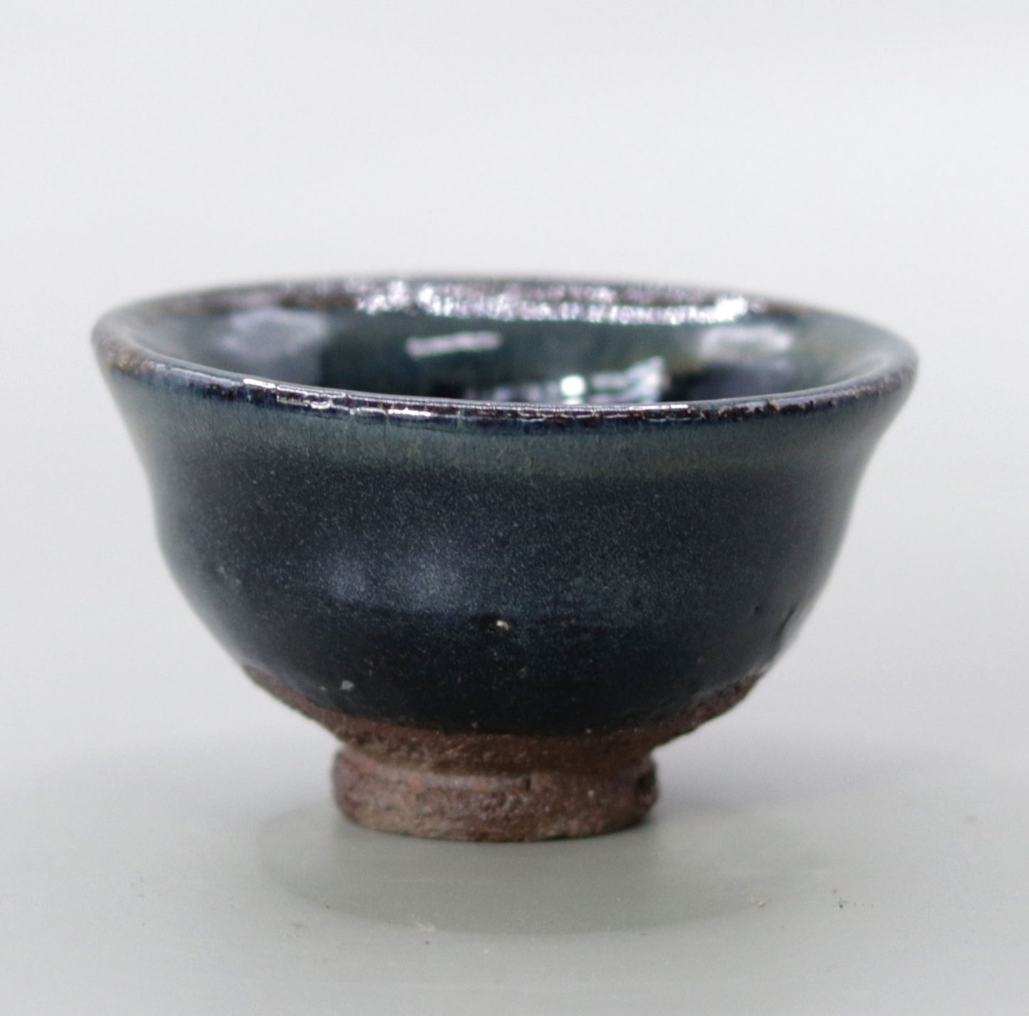 Iron glazed sake cup made from the foundation of the East Pagoda of Yakushiji Temple by Rakusai Bisai