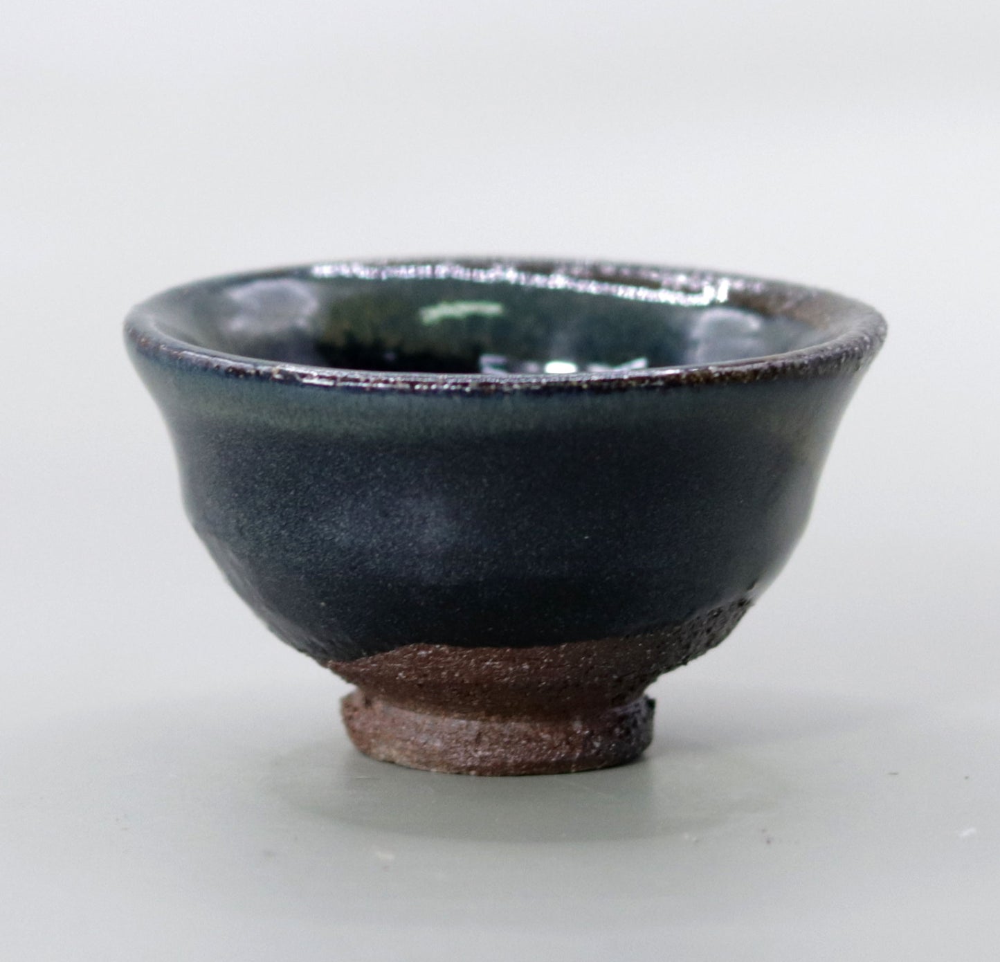 Iron glazed sake cup made from the foundation of the East Pagoda of Yakushiji Temple by Rakusai Bisai