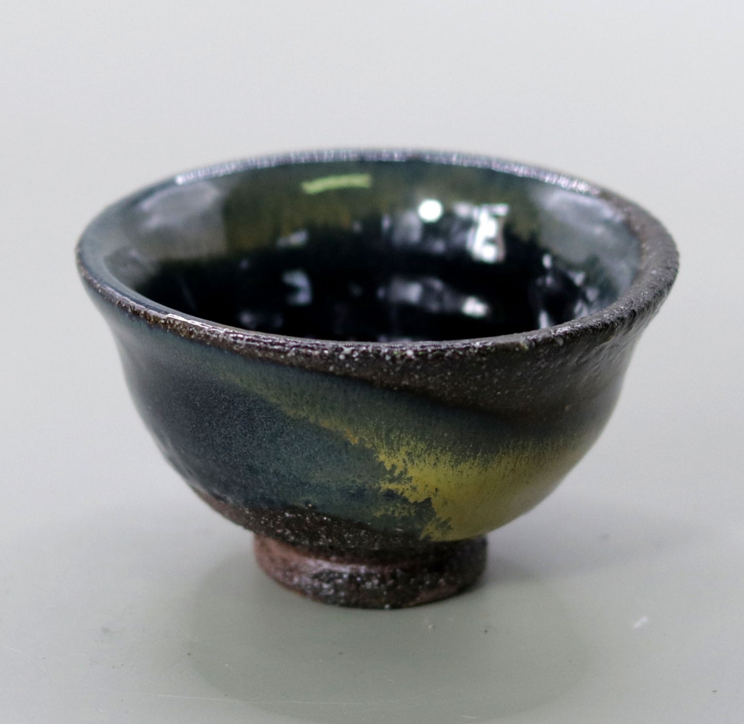 Iron glazed sake cup made from the foundation of the East Pagoda of Yakushiji Temple by Rakusai Bisai