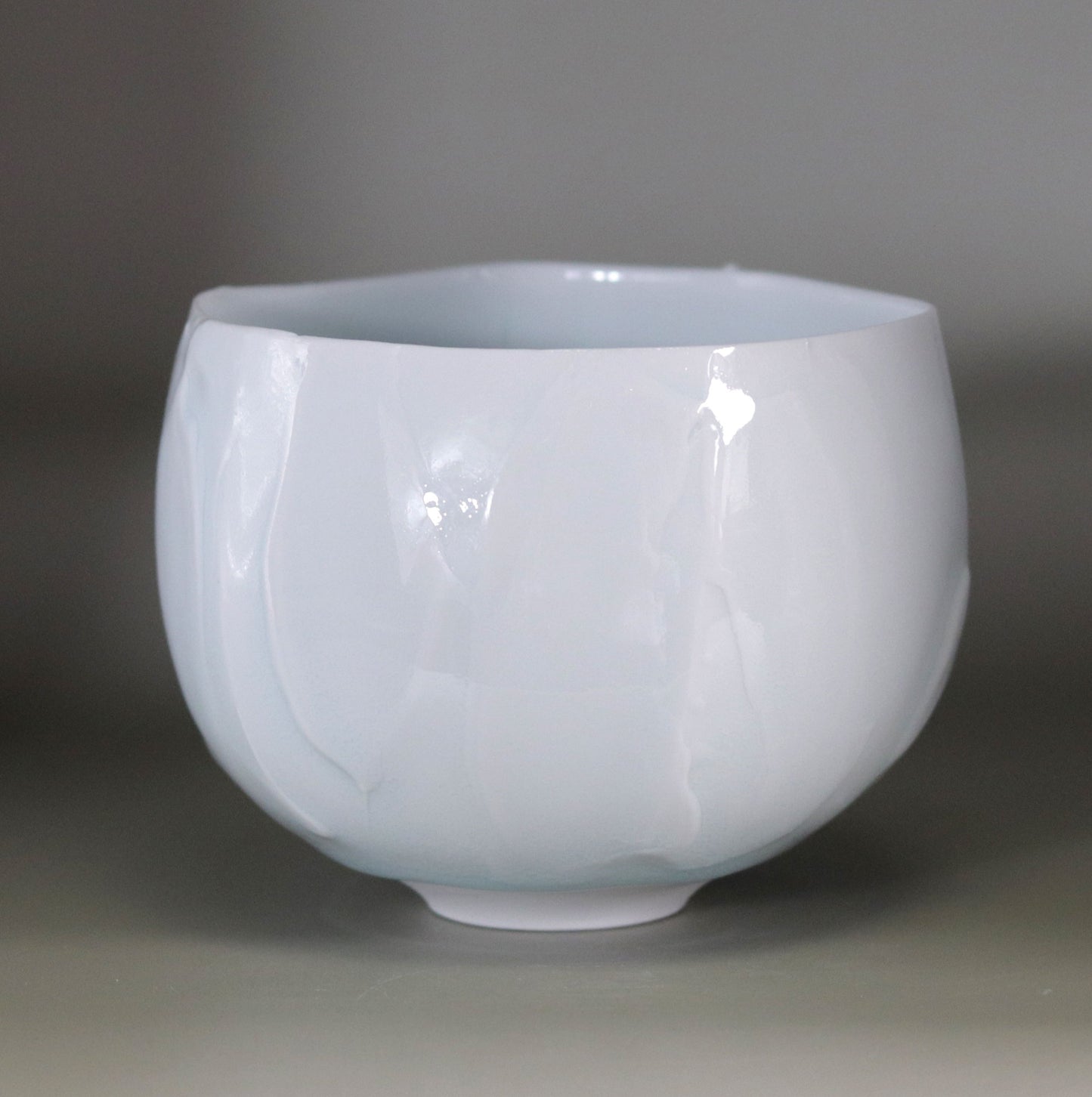 Blue and white chamfered tea bowl by Kotaro Ikura