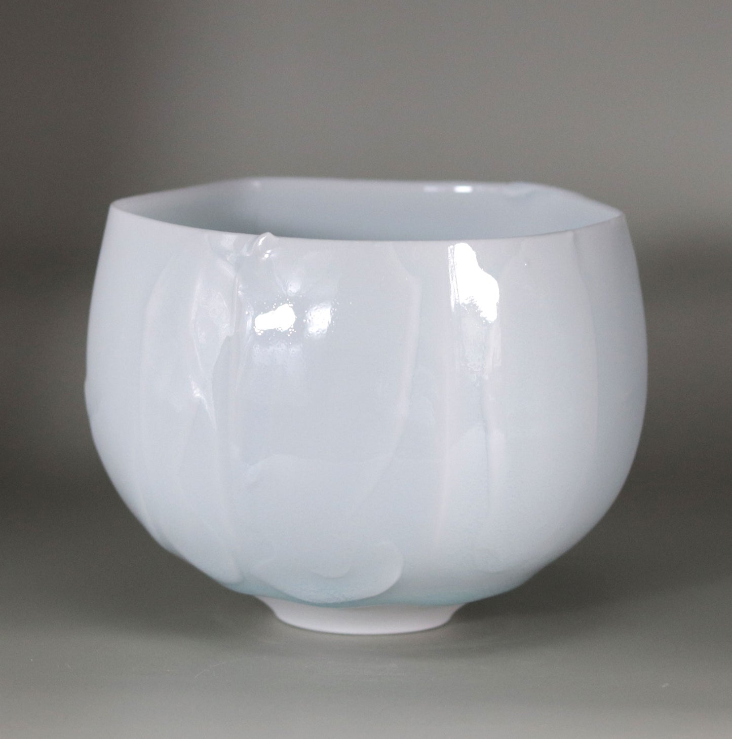 Blue and white chamfered tea bowl by Kotaro Ikura