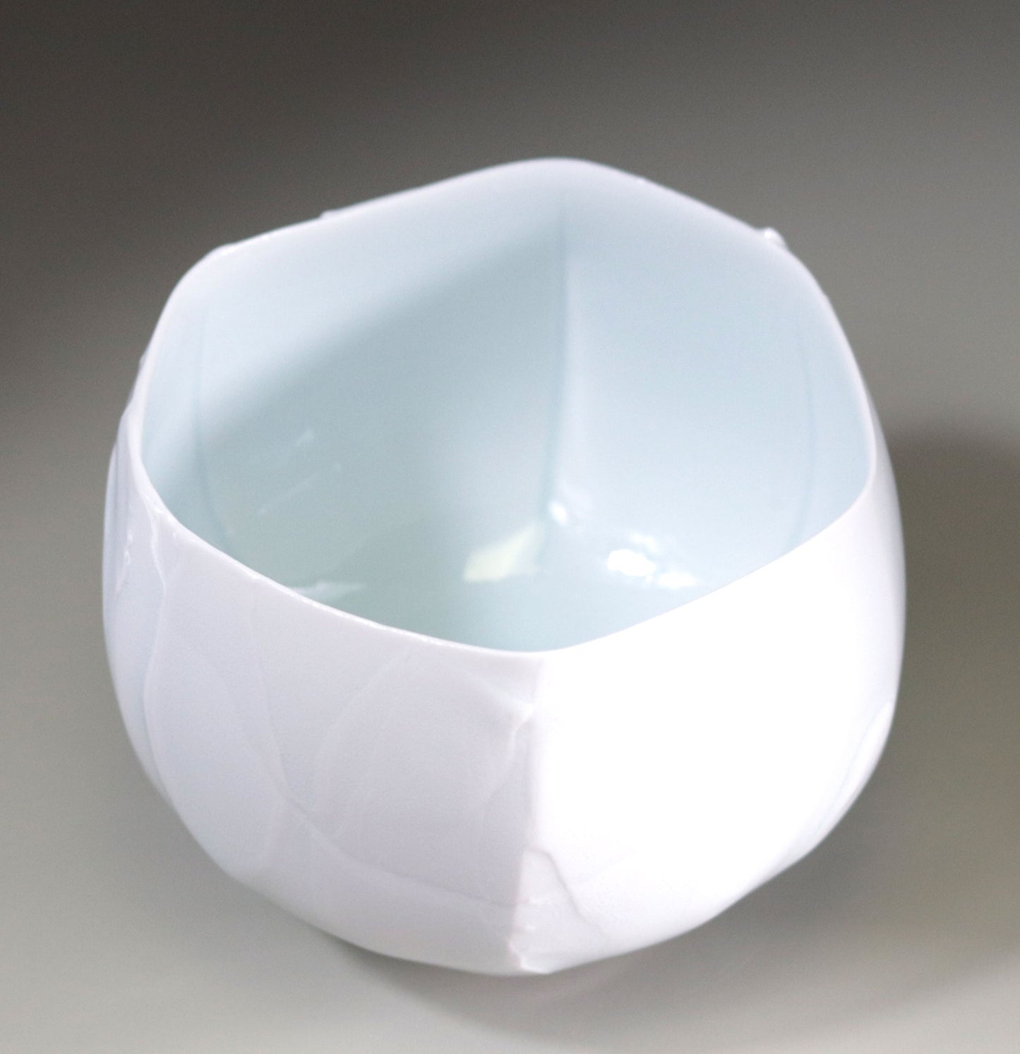 Blue and white chamfered tea bowl by Kotaro Ikura