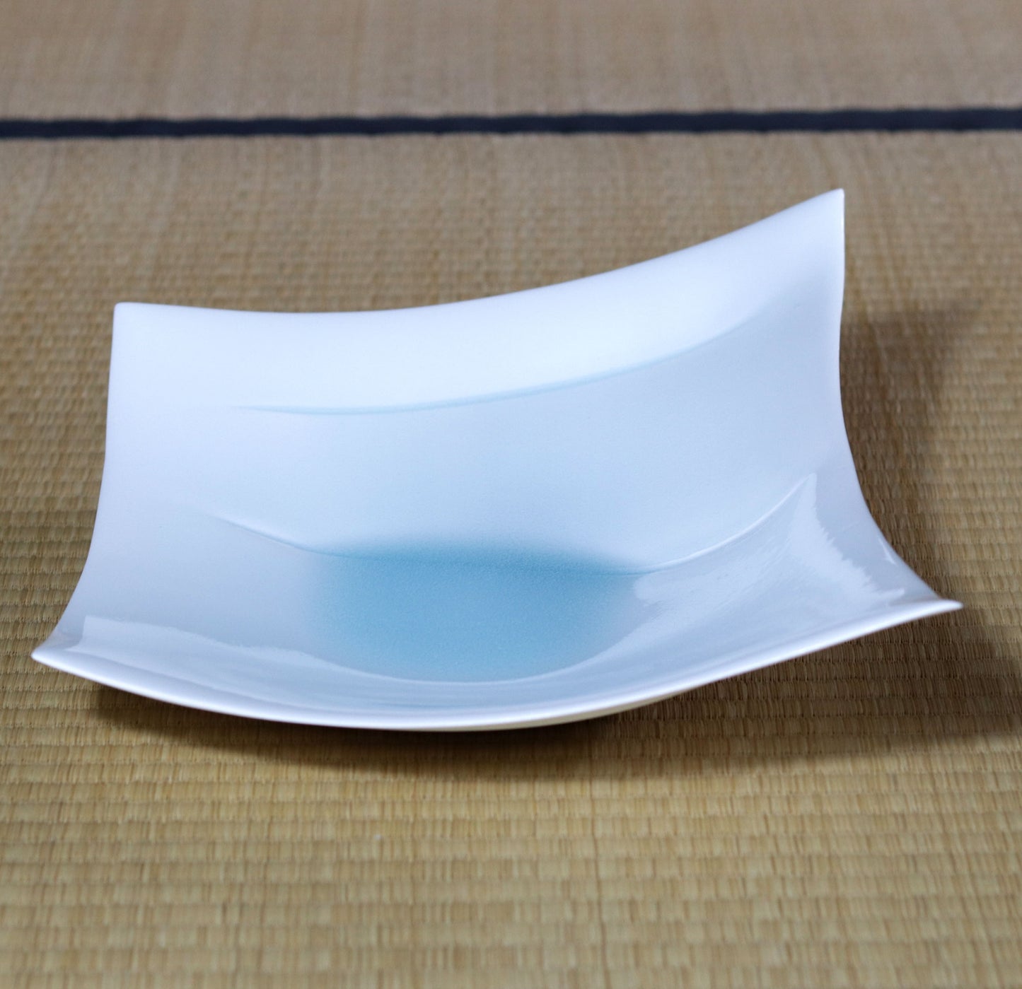 Blue and white magnetic boat vessel by Kotaro Ikura