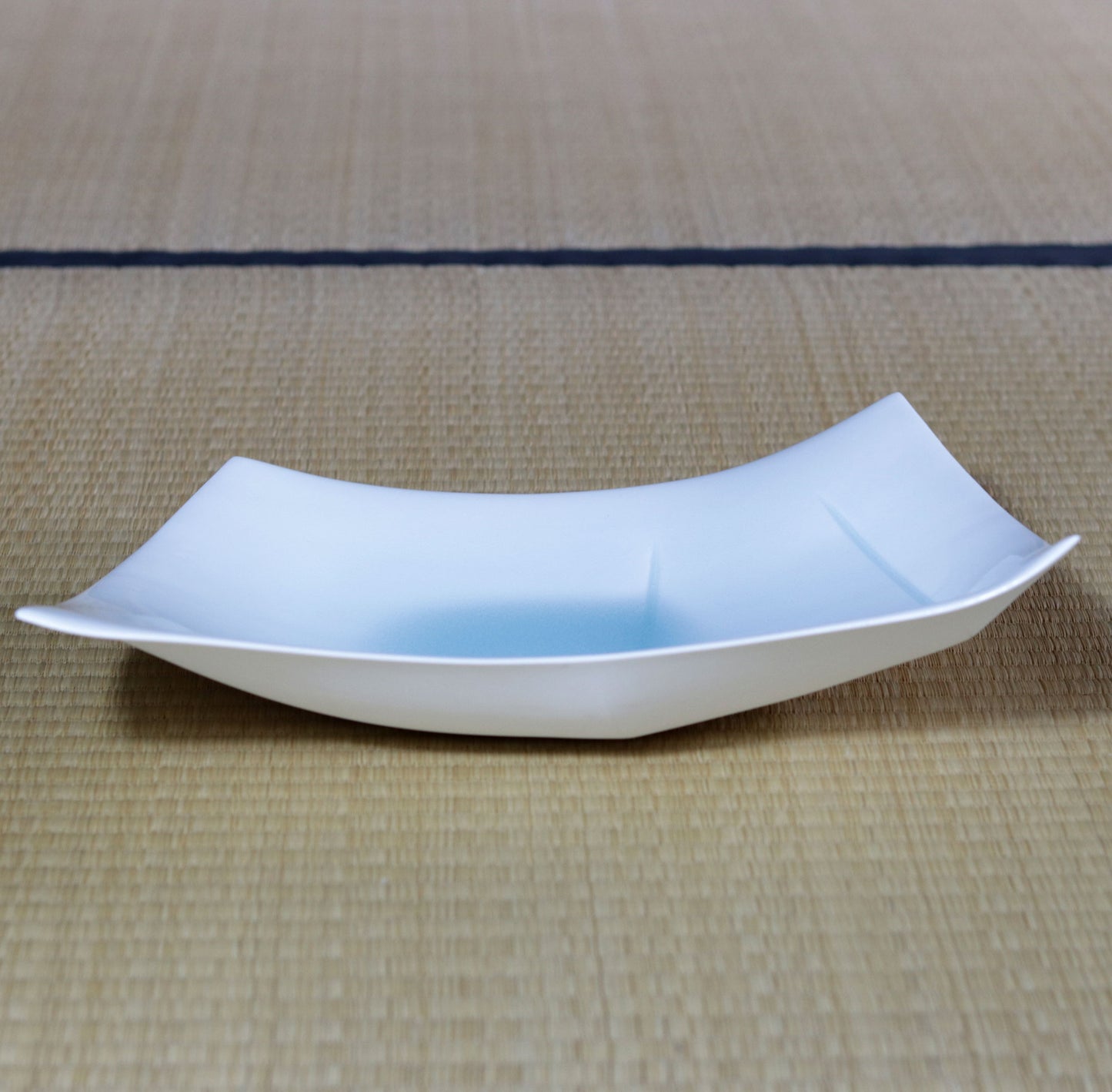 Blue and white magnetic boat vessel by Kotaro Ikura