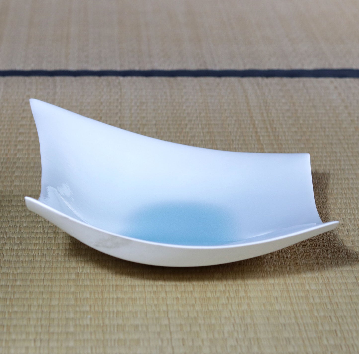 Blue and white magnetic boat vessel by Kotaro Ikura