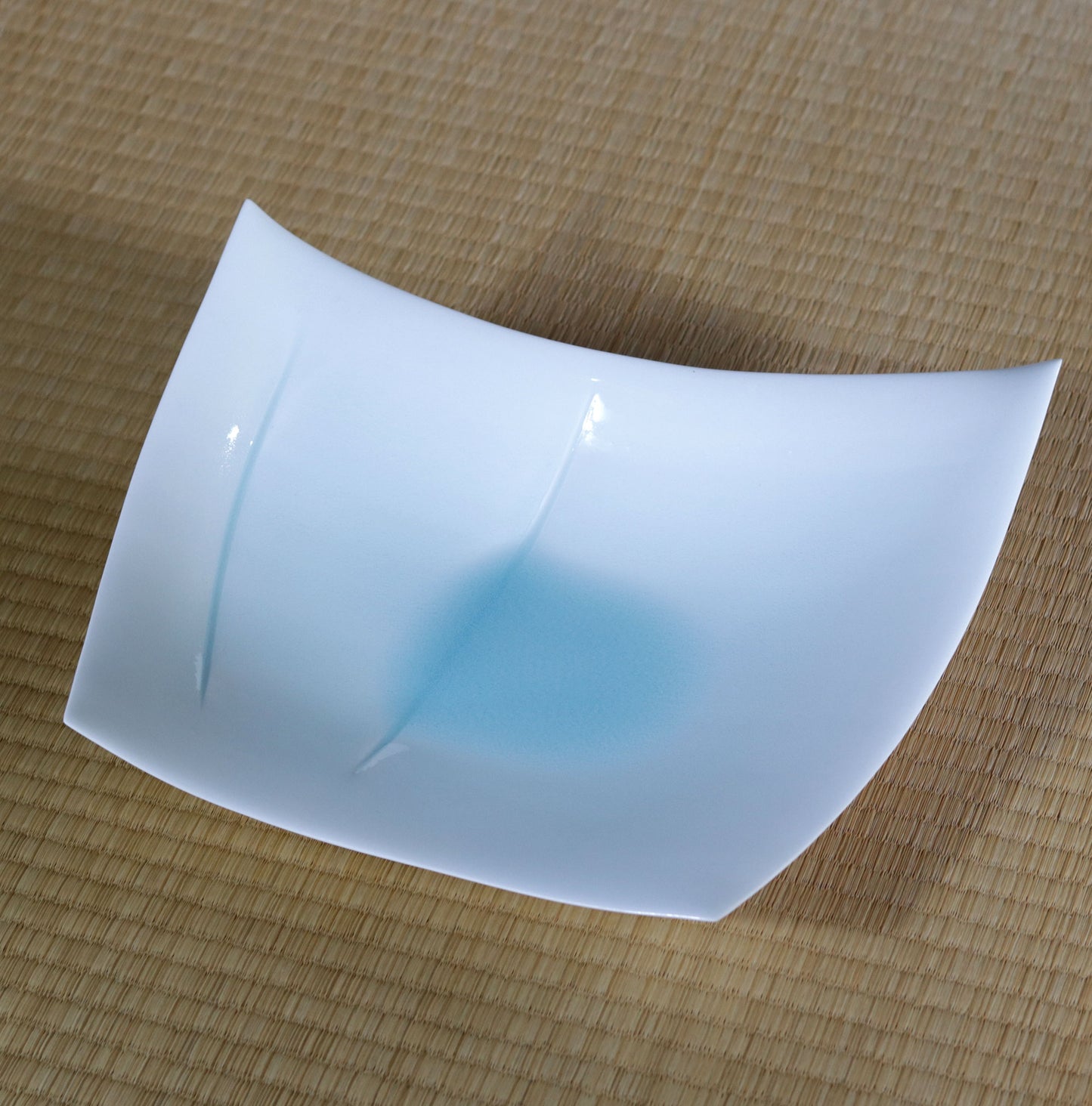 Blue and white magnetic boat vessel by Kotaro Ikura