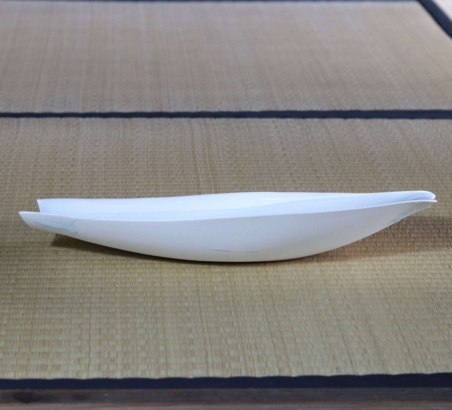 Blue and white magnetic boat vessel by Kotaro Ikura