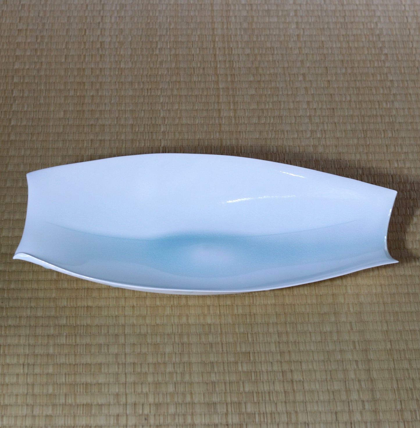 Blue and white magnetic boat vessel by Kotaro Ikura