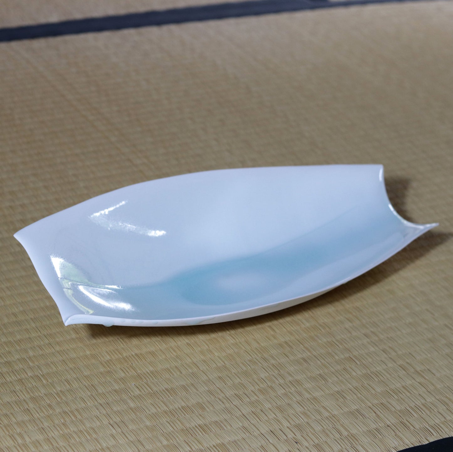 Blue and white magnetic boat vessel by Kotaro Ikura