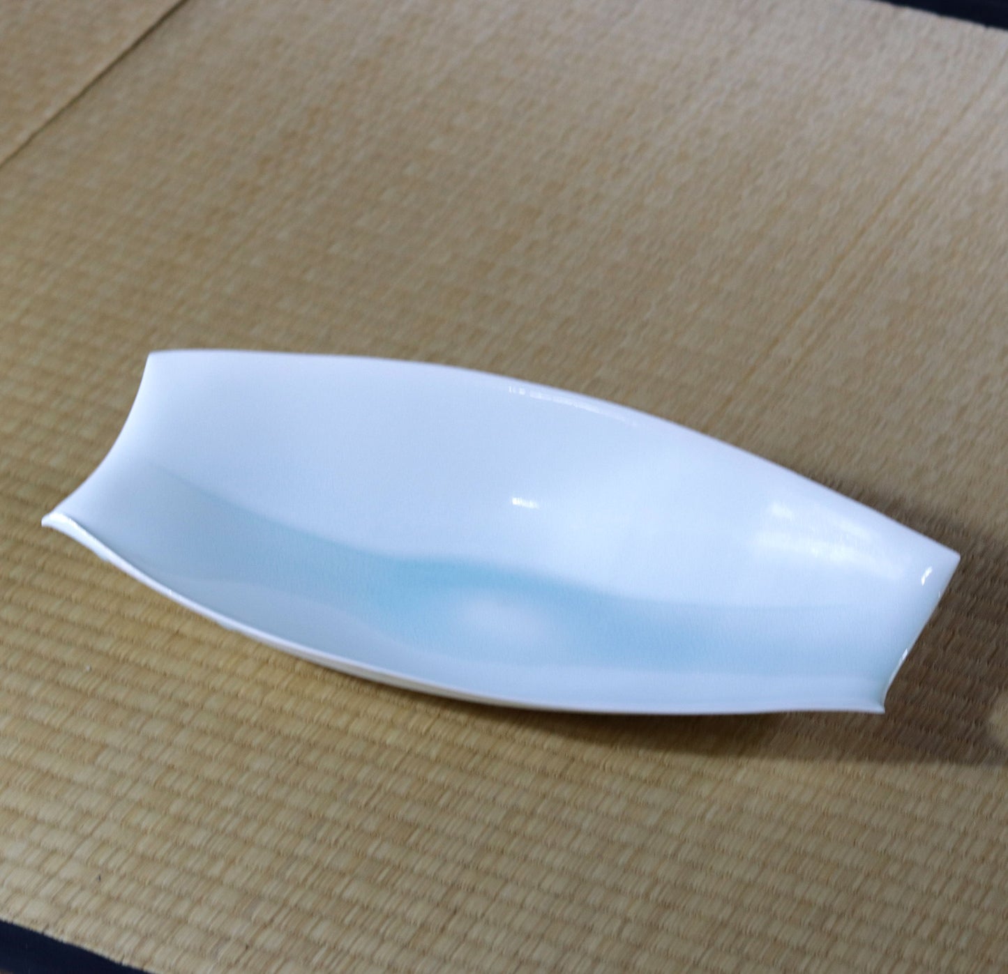 Blue and white magnetic boat vessel by Kotaro Ikura