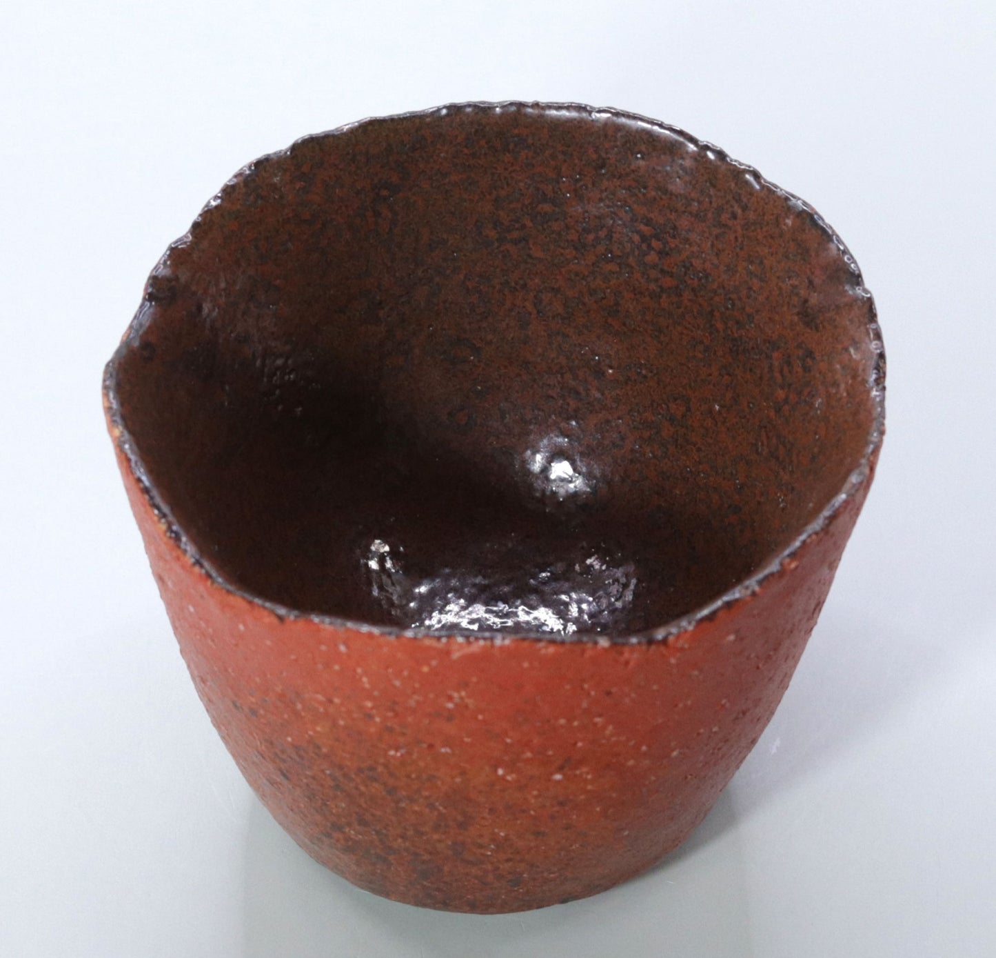 Powerful presence Red Concave Tea Bowl by Nishihata Tadashi