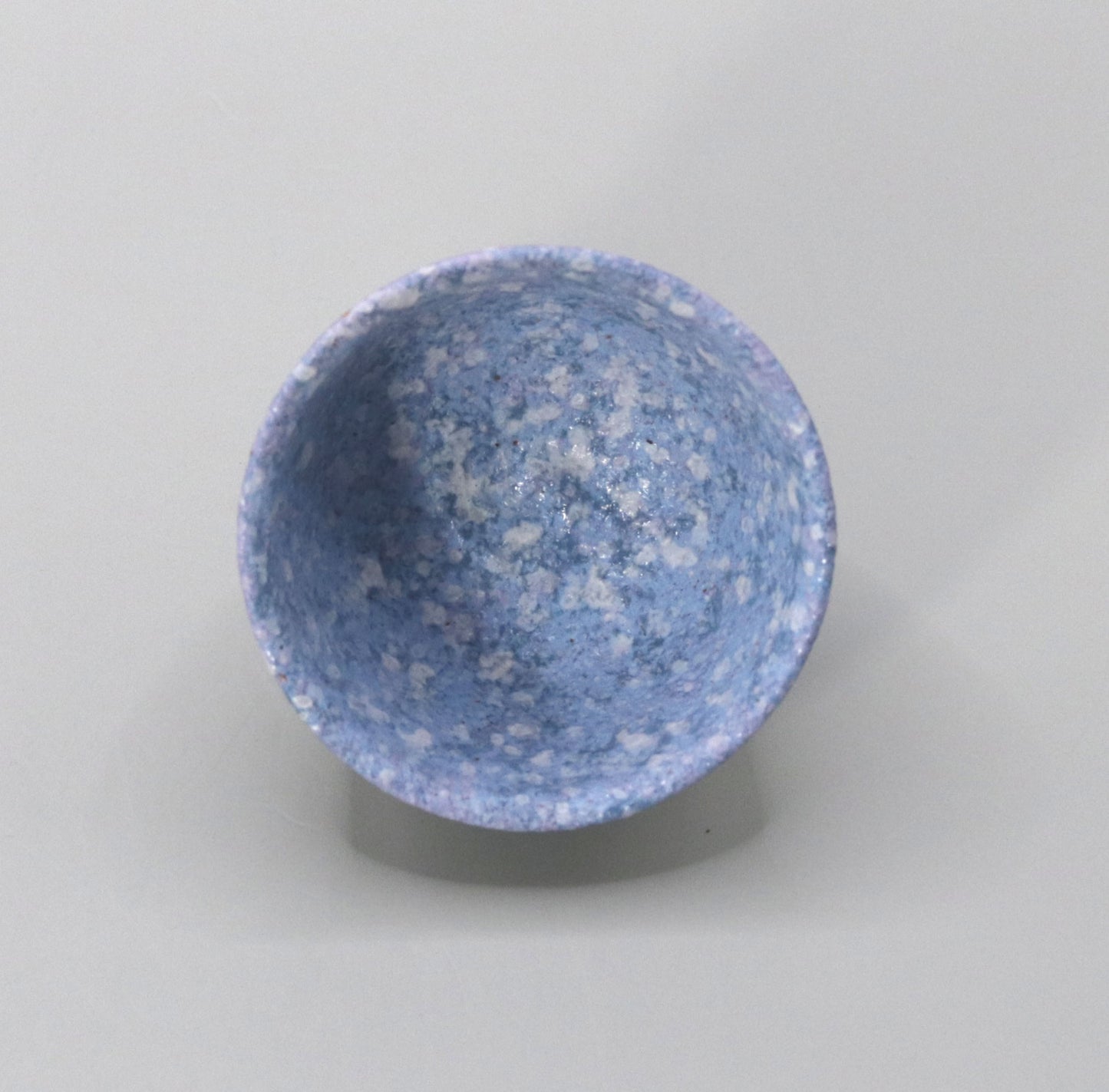 Blown mud gold and blue sake cup by Ichiji Shimizu