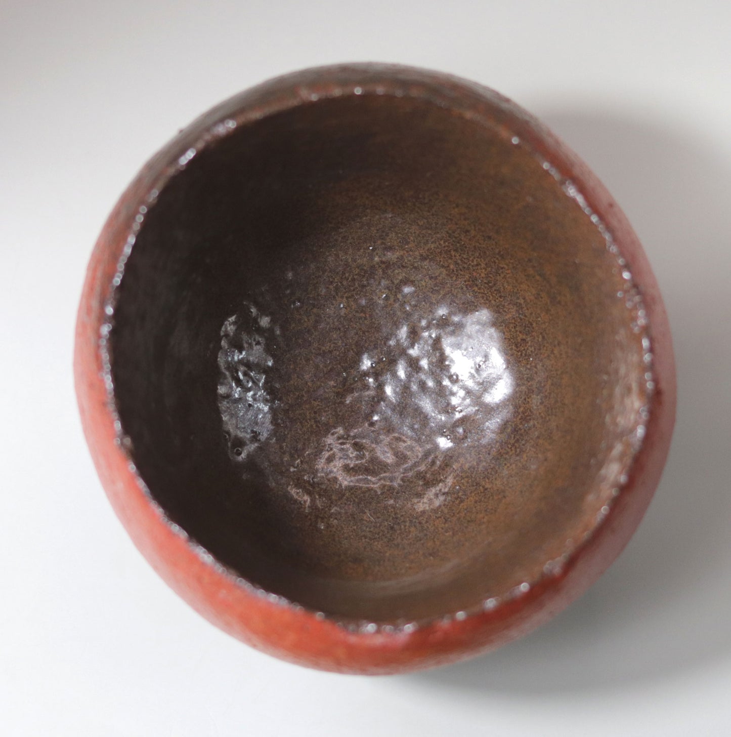 Tanba Red Concave Tea Bowl by Nishihata Tadashi